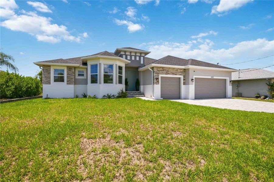 Front exterior of a new home in , Port Charlotte, FL, highlighting curb appeal (Image 25).
