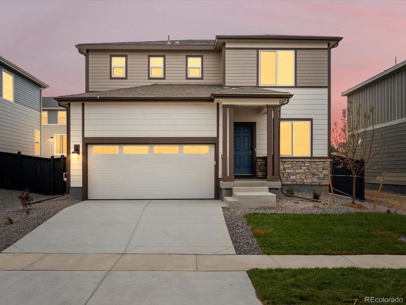 Front exterior of a new home in Westgate, Greeley, CO, highlighting curb appeal (Image 2).