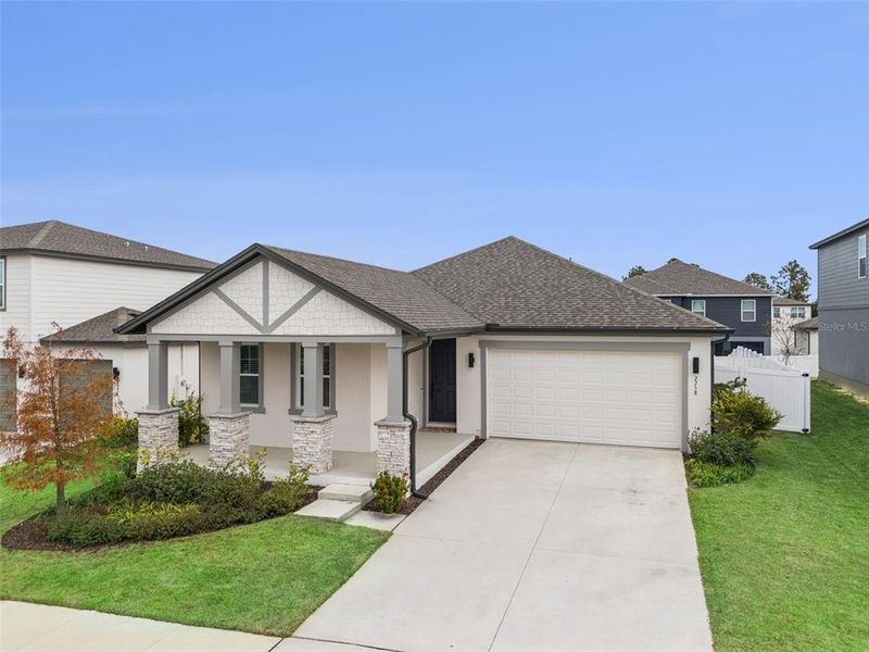Front exterior of a new home in , Minneola, FL, highlighting curb appeal (Image 26).
