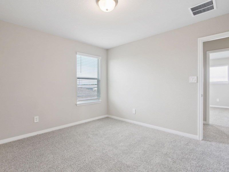 Spare room with carpet and baseboards Spare room with carpet and baseboards