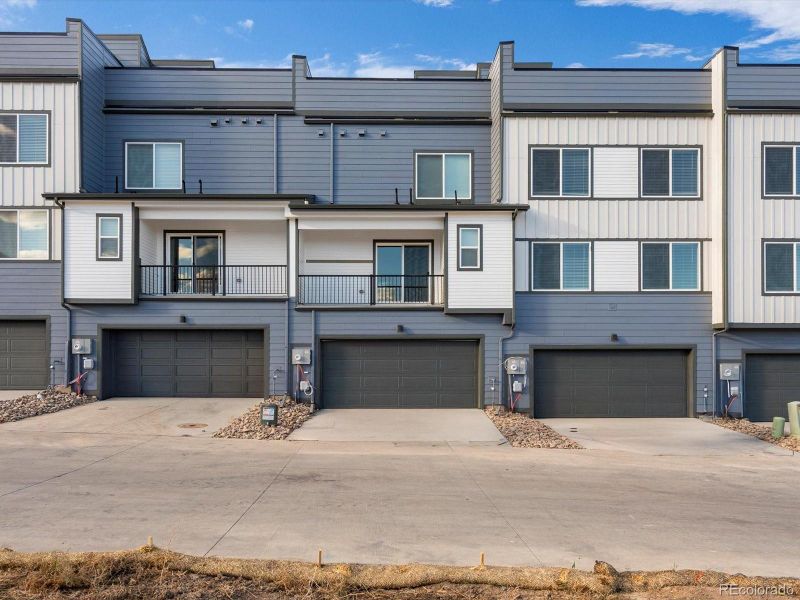 Front exterior of a new home in Three Hills, Morrison, CO, highlighting curb appeal (Image 22).