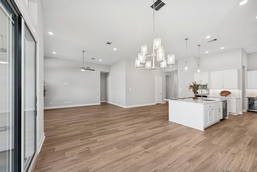 EXAMPLE PHOTO:  View from Dining towards Kitchen and Living area.  The 12 ft ceiling make it feel even more spacious!