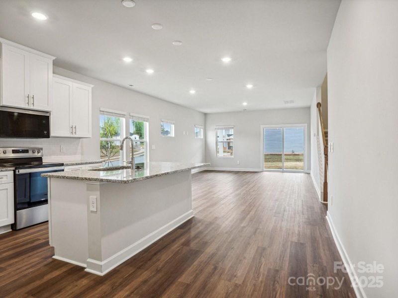 Photos are not of the actual home, but are photos of the builder home with same floorplan with similar interior finishes.