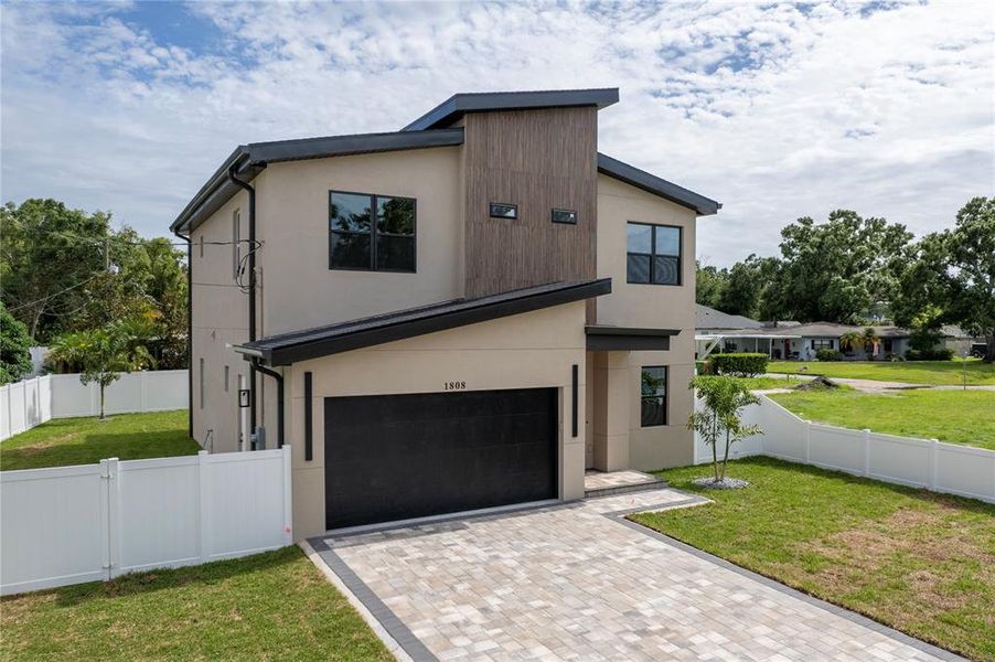 Front exterior of a new home in , Tampa, FL, highlighting curb appeal (Image 44).