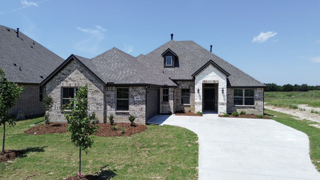 Front exterior of a new home in Forest Ridge Estates, Greenville, TX, highlighting curb appeal (Image 1). Front exterior of a new home in Forest Ridge Estates, Greenville, TX, highlighting curb appeal (Image 1).
