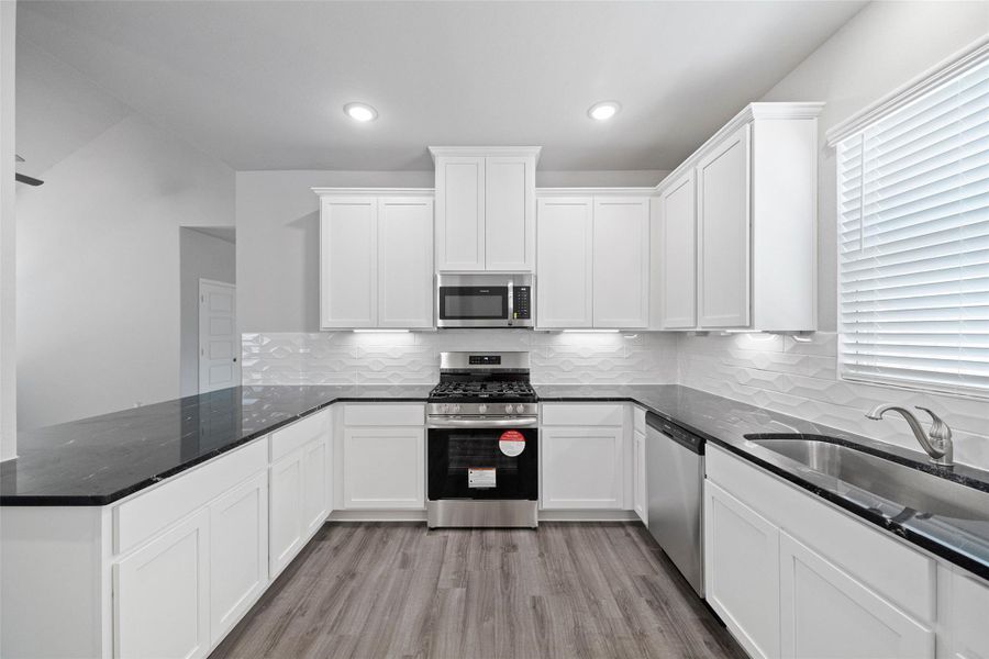 Furnished interior view inside a new home in Sunterra, Katy (Image 10).