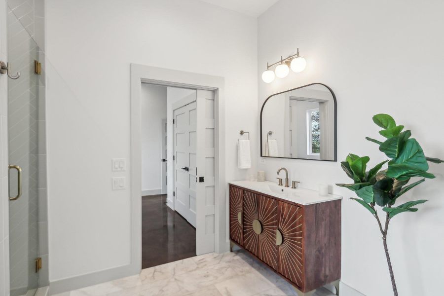 Bathroom with vanity and a shower stall Bathroom with vanity and a shower stall