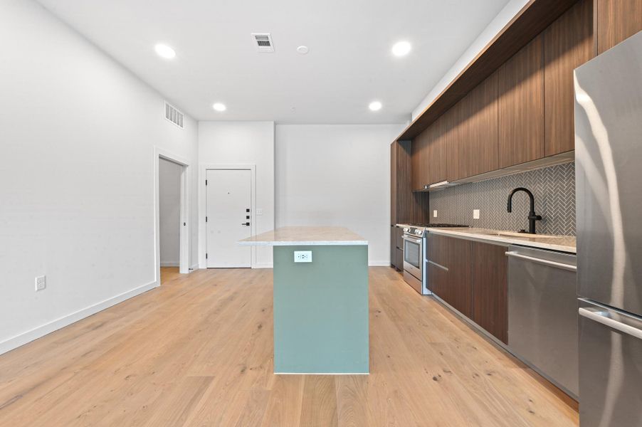 Furnished interior view inside a new home in One Oak, Austin (Image 7).