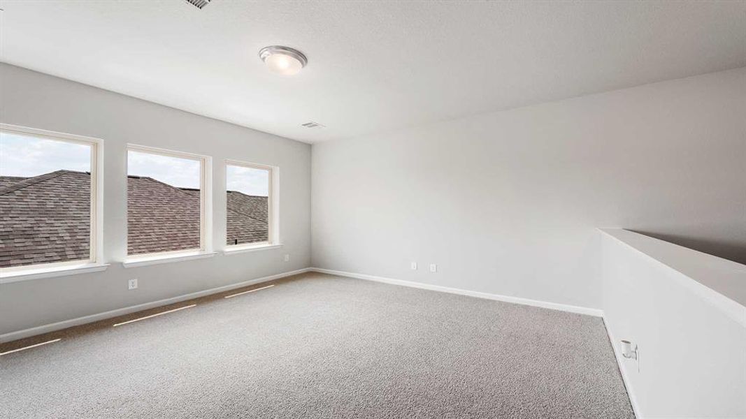 Unfurnished room with carpet