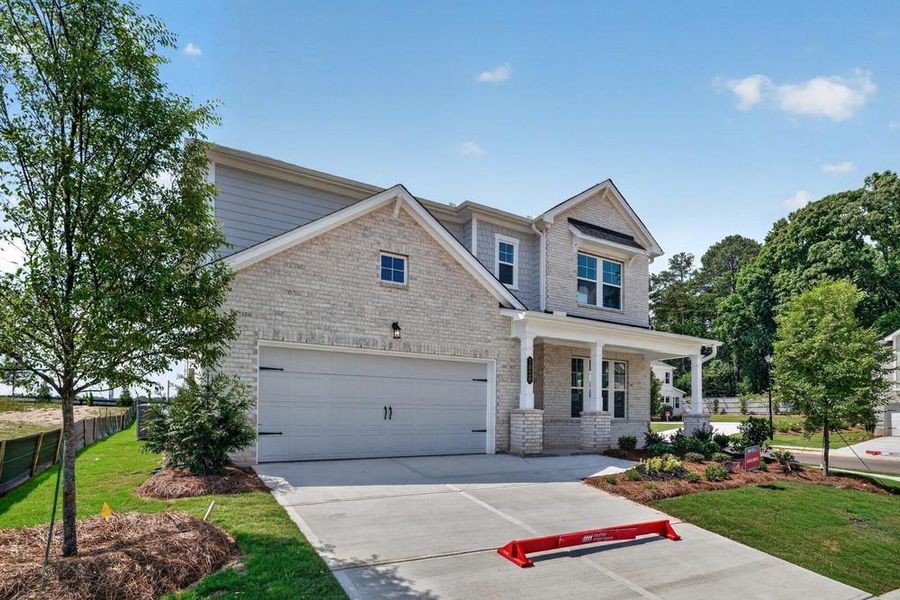 Front exterior of a new home in Nichols Farm, Dacula, GA, highlighting curb appeal (Image 2). Front exterior of a new home in Nichols Farm, Dacula, GA, highlighting curb appeal (Image 2).