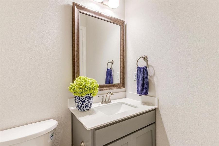 Bathroom featuring vanity and toilet