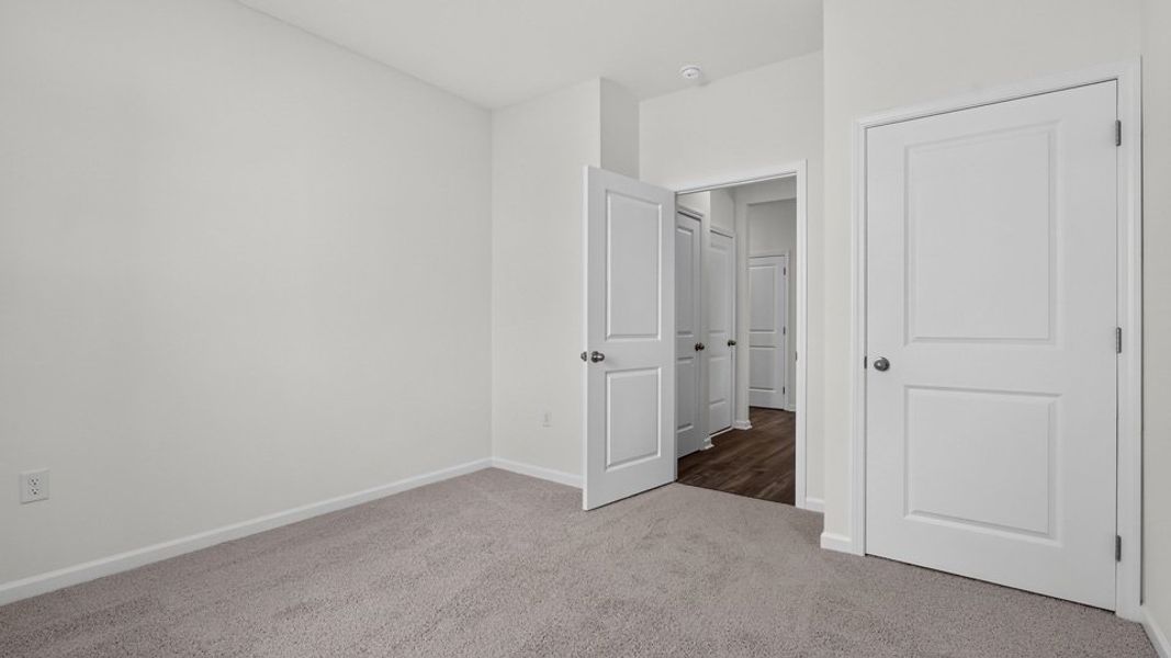 Spacious, unfurnished interior of a new home in The Grove at Matthews Landing, Fuquay Varina (Image 26).