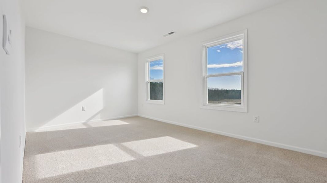 Representative unfurnished interior of a home built from the Wylie by D.R. Horton in Eagle Creek, Fuquay Varina (Image 27).