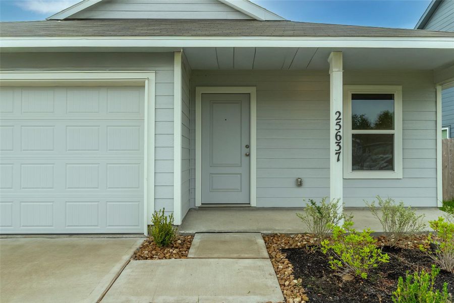 The covered front patio is the perfect spot to sit and relax after a long day! The covered front patio is the perfect spot to sit and relax after a long day!