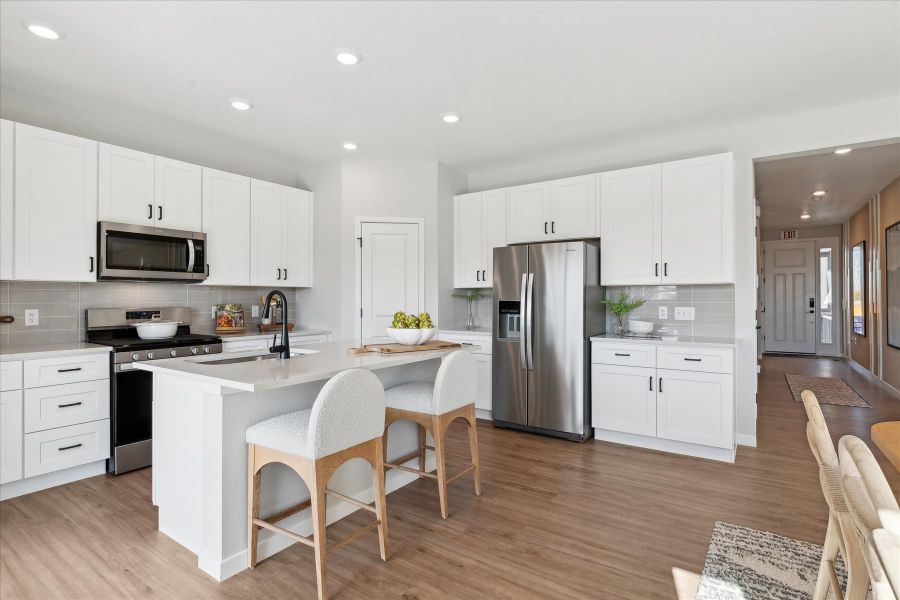 A kitchen with white cabinets. A kitchen with white cabinets.