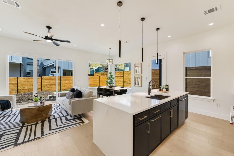 There is a seamless transition from the chef’s kitchen to the dining and lounging areas. Large-format windows invite the outdoors in, ensuring the entire floor is bathed in natural light.