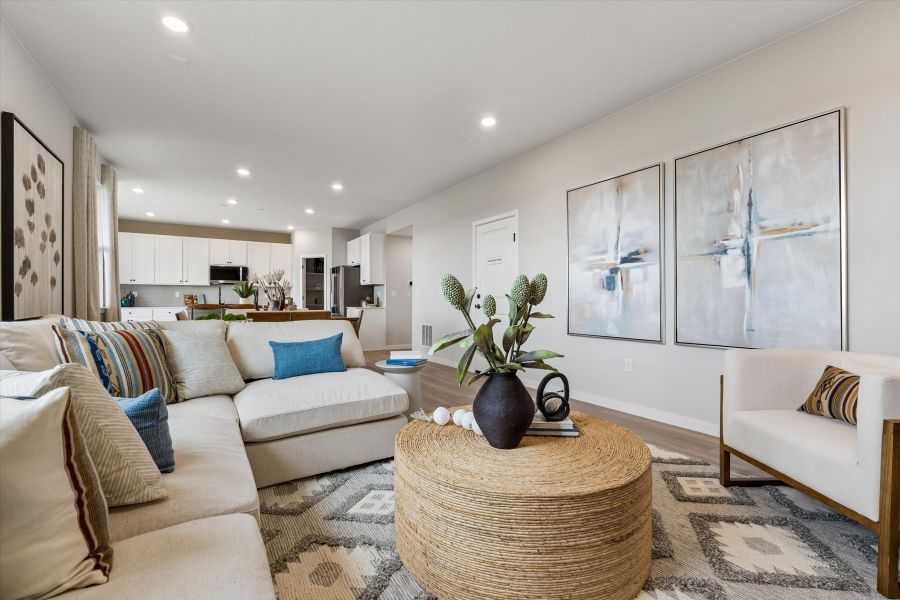 A living room with a couch and a coffee table. A living room with a couch and a coffee table.