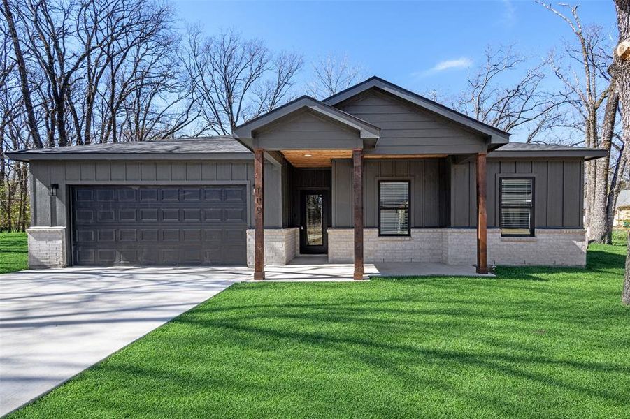 Front exterior of a new home in , Payne Springs, TX, highlighting curb appeal (Image 2). Front exterior of a new home in , Payne Springs, TX, highlighting curb appeal (Image 2).