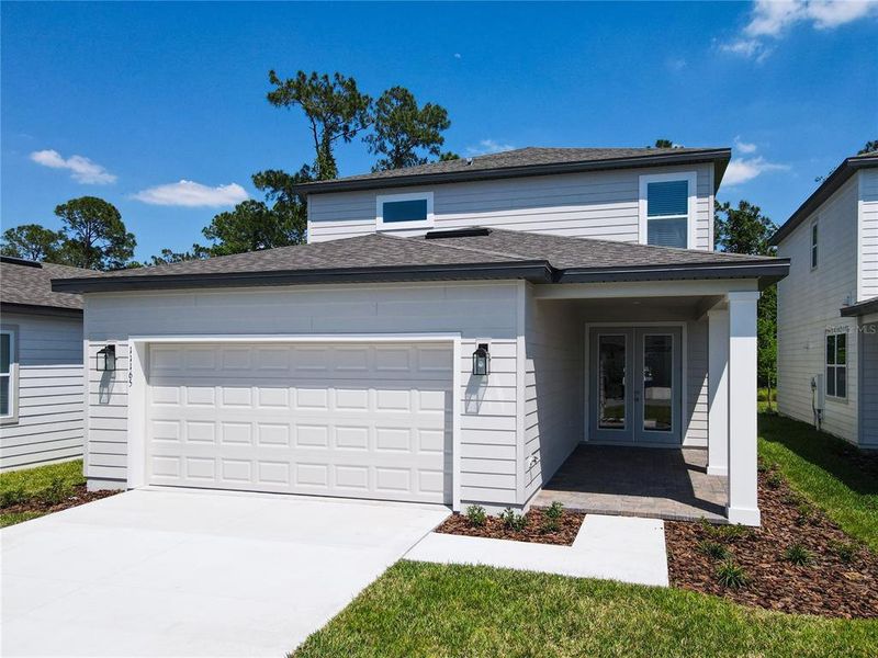Front exterior of a new home in , Winter Garden, FL, highlighting curb appeal (Image 24).