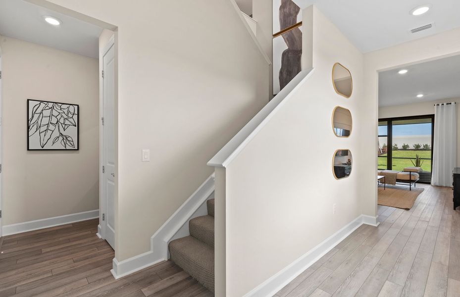 An impressive and welcoming foyer in a thoughtfully designed two-story home