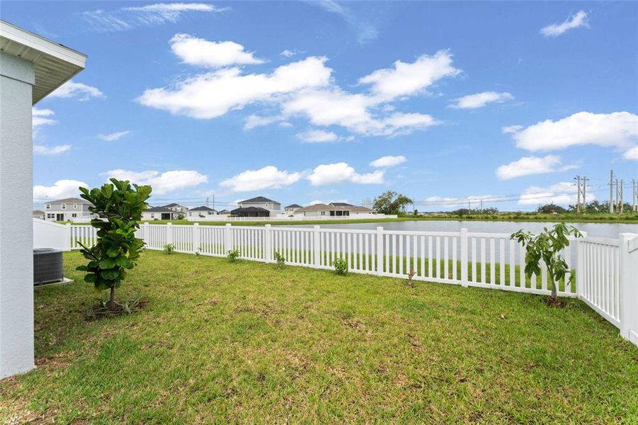 Front exterior of a new home in Sawgrass Lakes I, Parrish, FL, highlighting curb appeal (Image 19).
