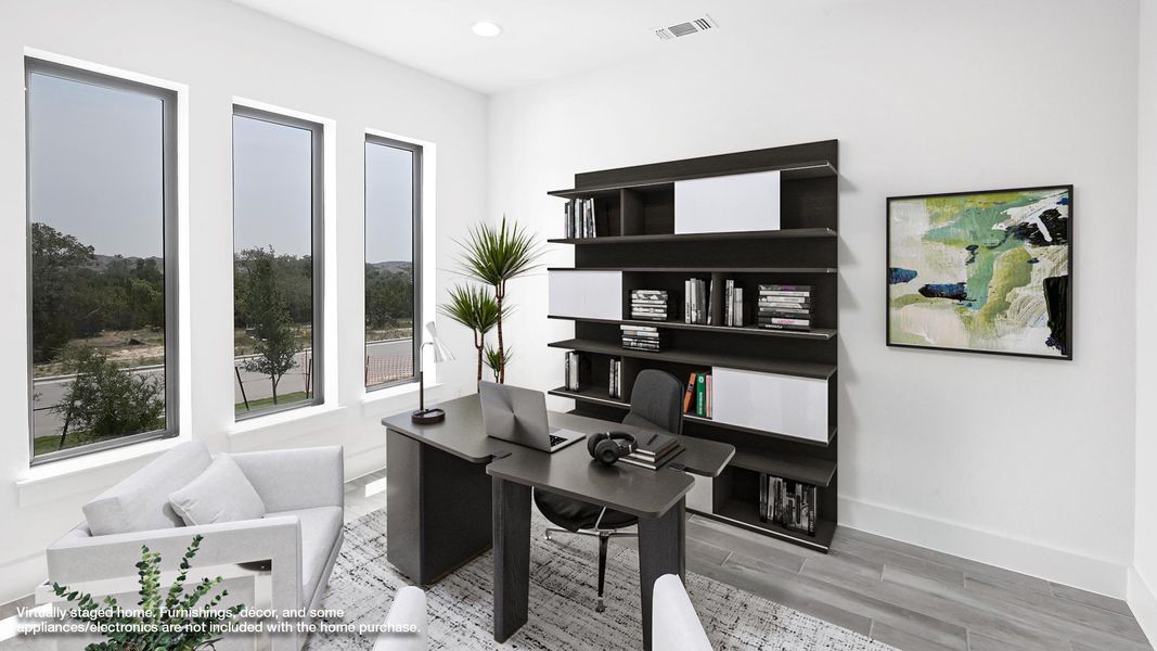 Office area with wood finished floors, baseboards, and recessed lighting Office area with wood finished floors, baseboards, and recessed lighting
