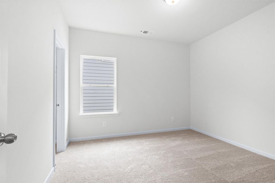 The Dove- Bedroom 3. Home under construction, photo used for illustrative purposes only, colors and options will vary.
