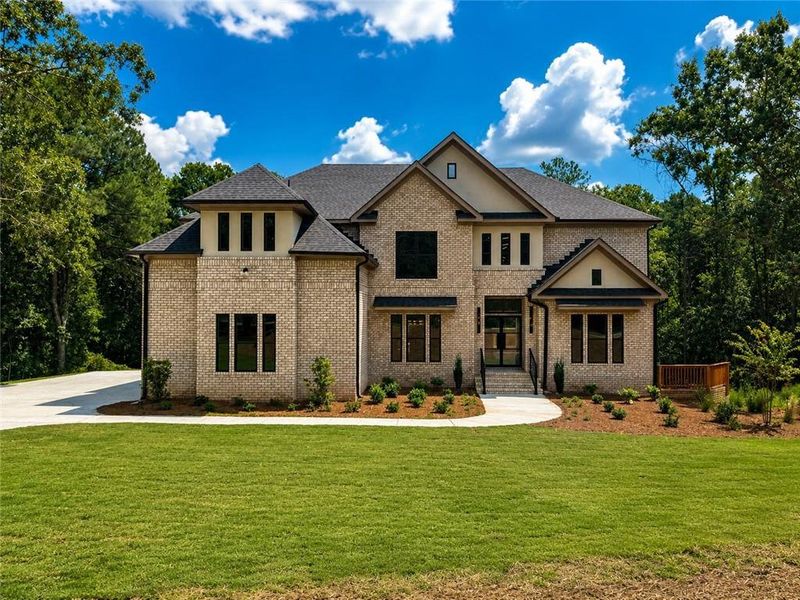 Front exterior of a new home in , Loganville, GA, highlighting curb appeal (Image 23).