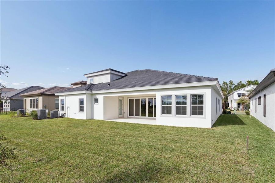 Exterior details and patio area of a home in Two Rivers, Zephyrhills (Image 4).