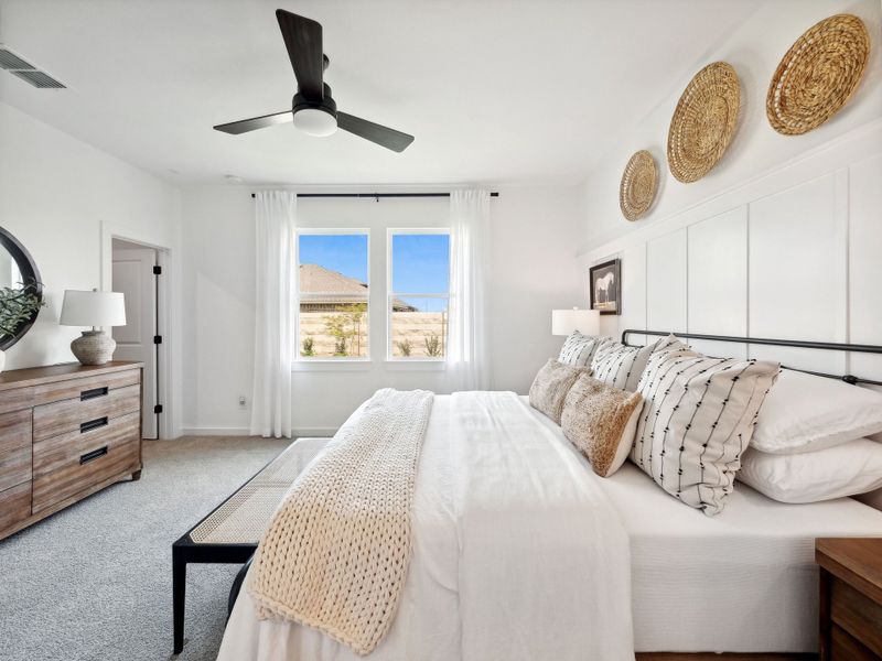 Primary suite with decorative feature wall Primary suite with decorative feature wall