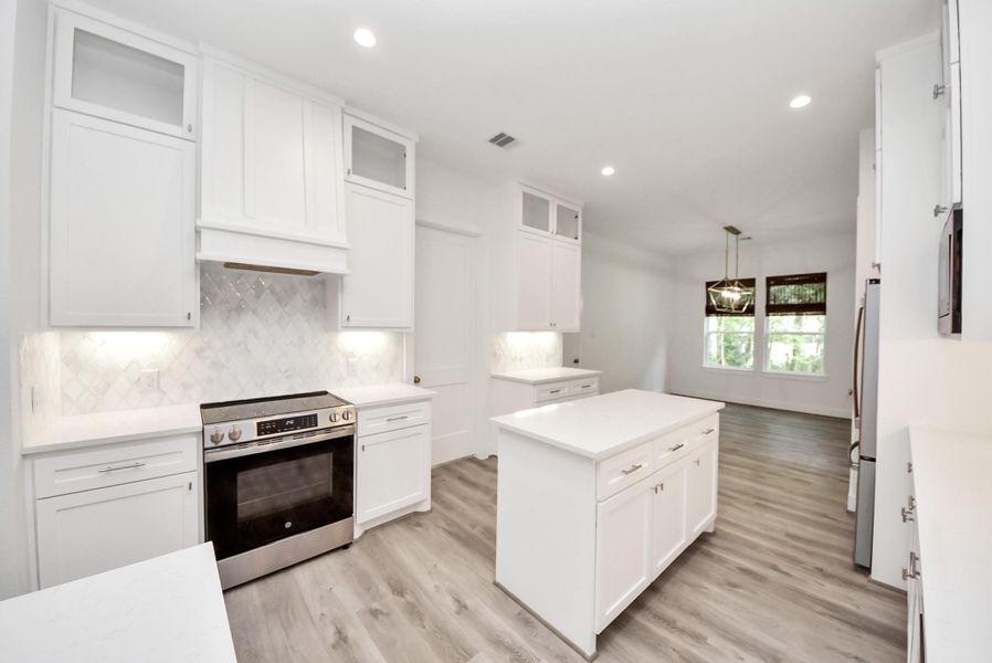Spacious kitchen with large island and open layout.