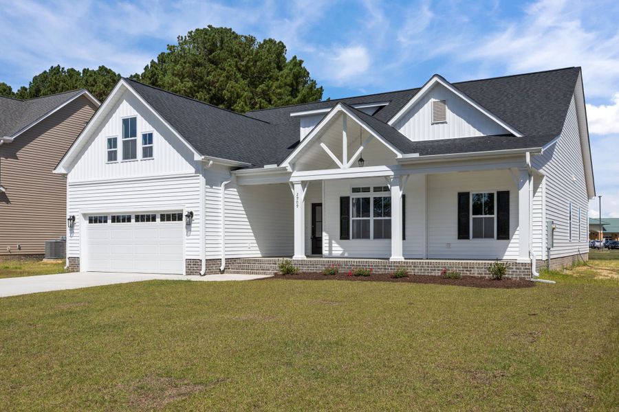 Front exterior of a new home in The Preserve at Langston, Winterville, NC, highlighting curb appeal (Image 25).
