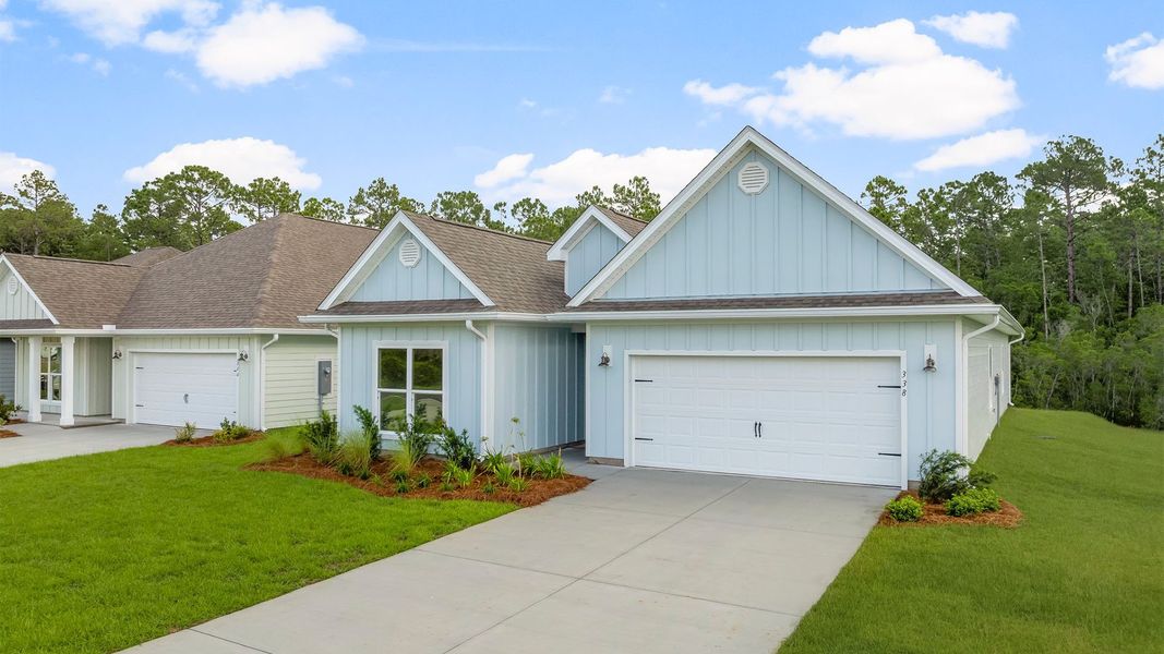 Front exterior of a new home in Buffer Farms, Port Saint Joe, FL, highlighting curb appeal (Image 16). Front exterior of a new home in Buffer Farms, Port Saint Joe, FL, highlighting curb appeal (Image 16).