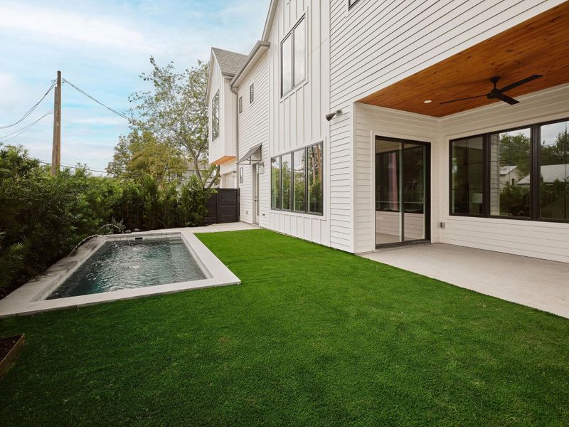 View of yard with a patio area, a ceiling fan, and an outdoor pool View of yard with a patio area, a ceiling fan, and an outdoor pool