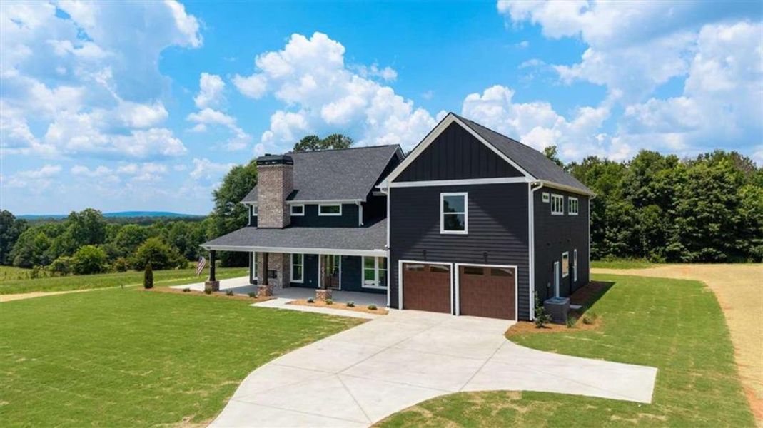 Front exterior of a new home in , Roopville, GA, highlighting curb appeal (Image 29).