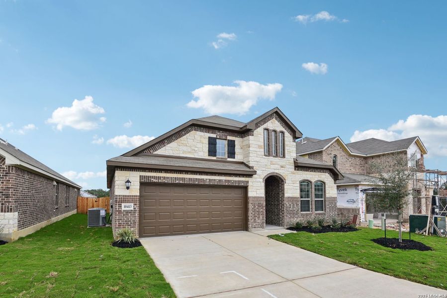 Front exterior of a new home in Fox Falls, Boerne, TX, highlighting curb appeal (Image 22).