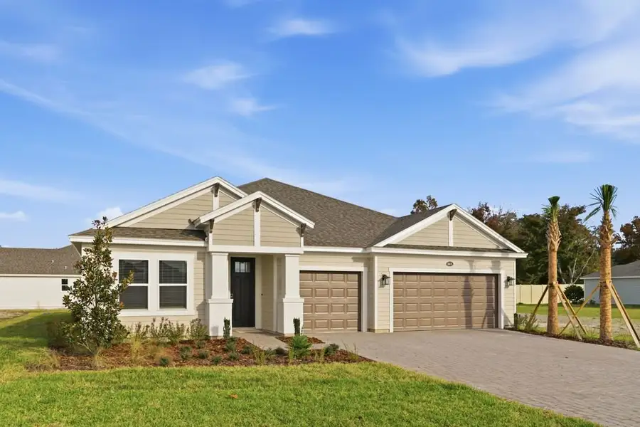 Front exterior of a new home in Headwaters at Lofton Creek, Yulee, FL, highlighting curb appeal (Image 2).