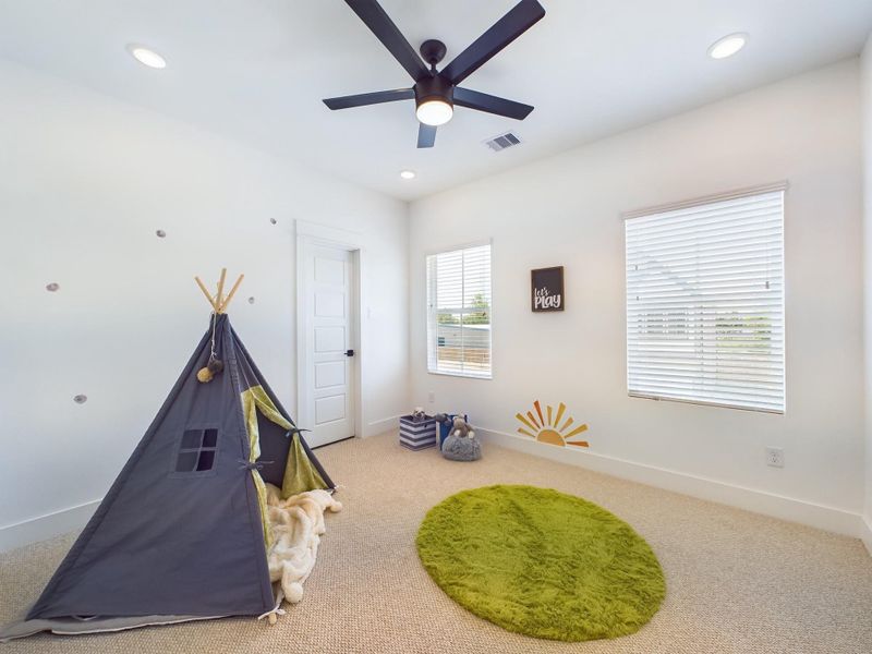 Secondary bedroom on second floor. FINISHES & FLOOR PLANS WILL VARY! Ceiling fans are not included!
