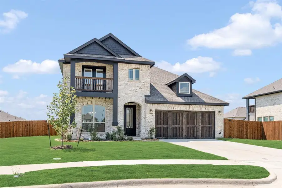Front exterior of a new home in Trees Farm, DeSoto, TX, highlighting curb appeal (Image 2). Front exterior of a new home in Trees Farm, DeSoto, TX, highlighting curb appeal (Image 2).