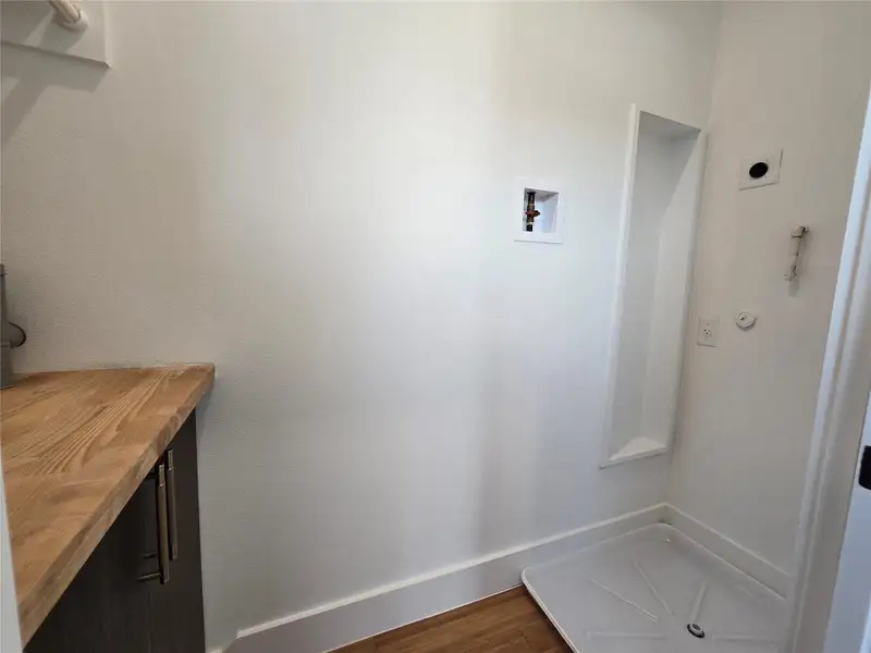 Mudroom featuring baseboards and dark wood finished floors Mudroom featuring baseboards and dark wood finished floors