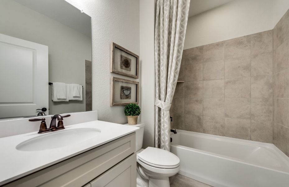 Secondary bathroom with tile-surround shower