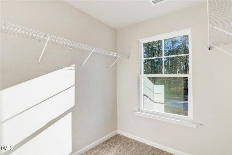 39-Primary owner walk-in closet with she