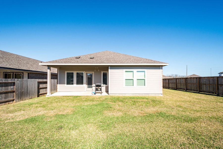 Exterior details and patio area of a home in Heights of Barbers Hill, Baytown (Image 29).