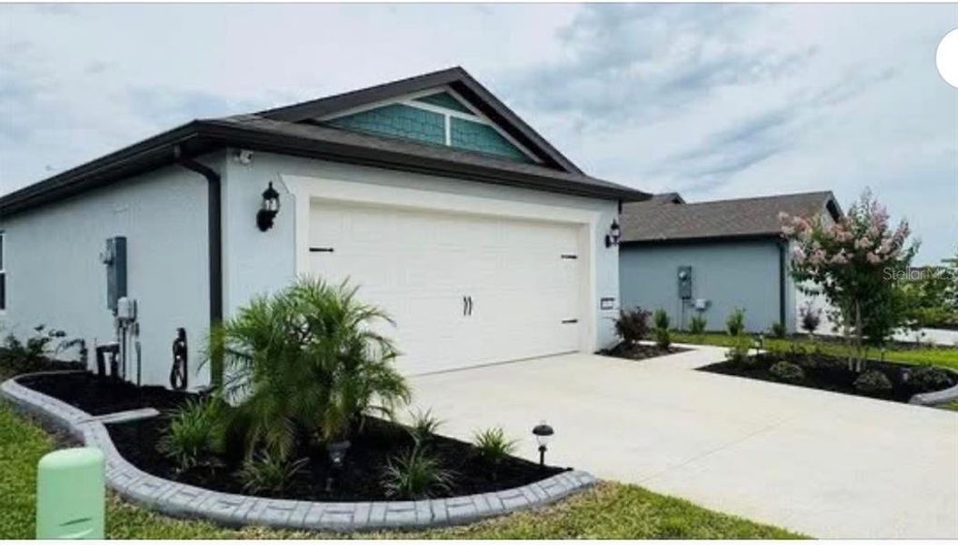 Front exterior of a new home in , Ocala, FL, highlighting curb appeal (Image 2).
