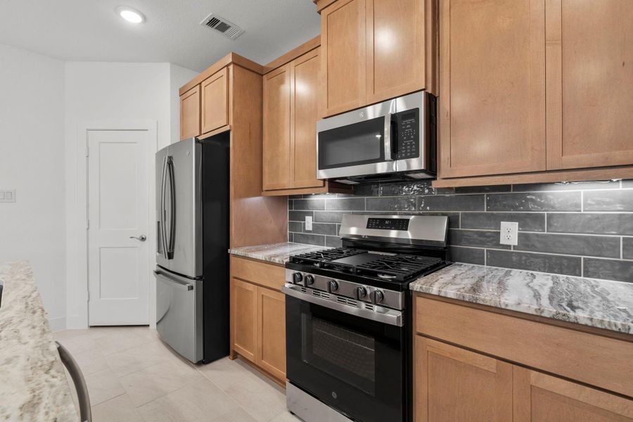 Furnished interior view inside a new home in Meridiana, Iowa Colony (Image 11).