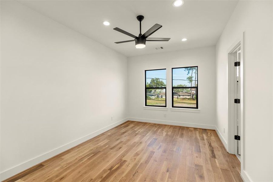 secondary bedroom with white oak floors, ensuite bath, good closet space