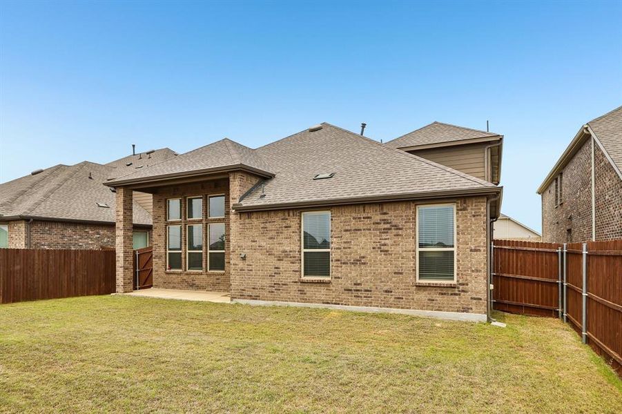 Exterior details and patio area of a home in Silverado, Aubrey (Image 26).