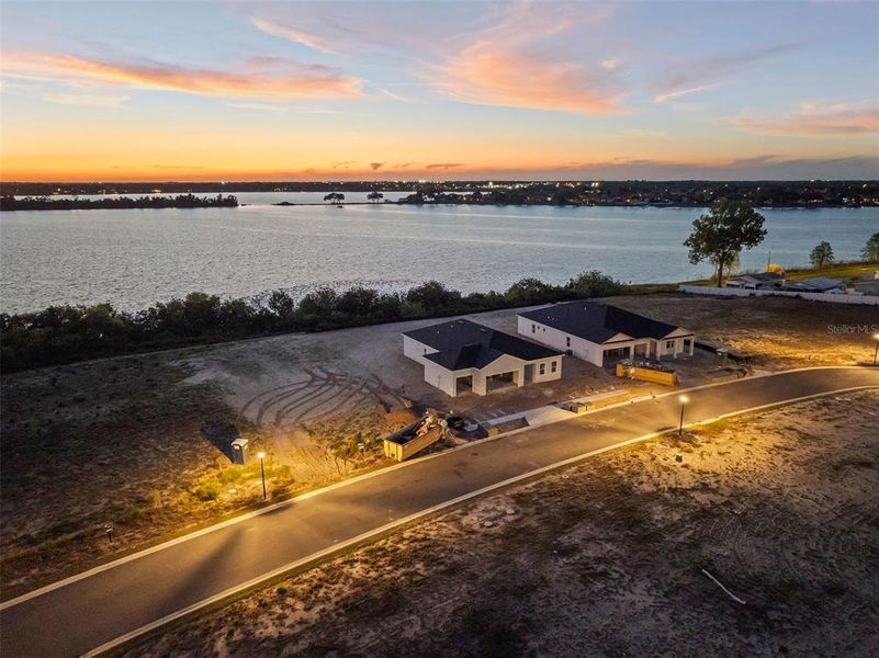 Front exterior of a new home in Ashton Covey, Winter Haven, FL, highlighting curb appeal (Image 18).