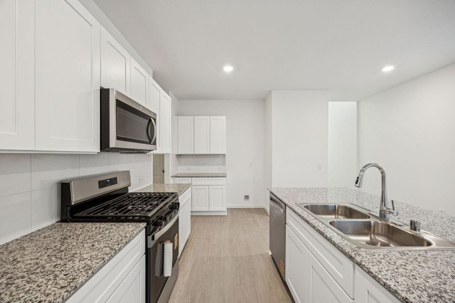 Furnished interior view inside a new home in Decker Farms, Magnolia (Image 6).