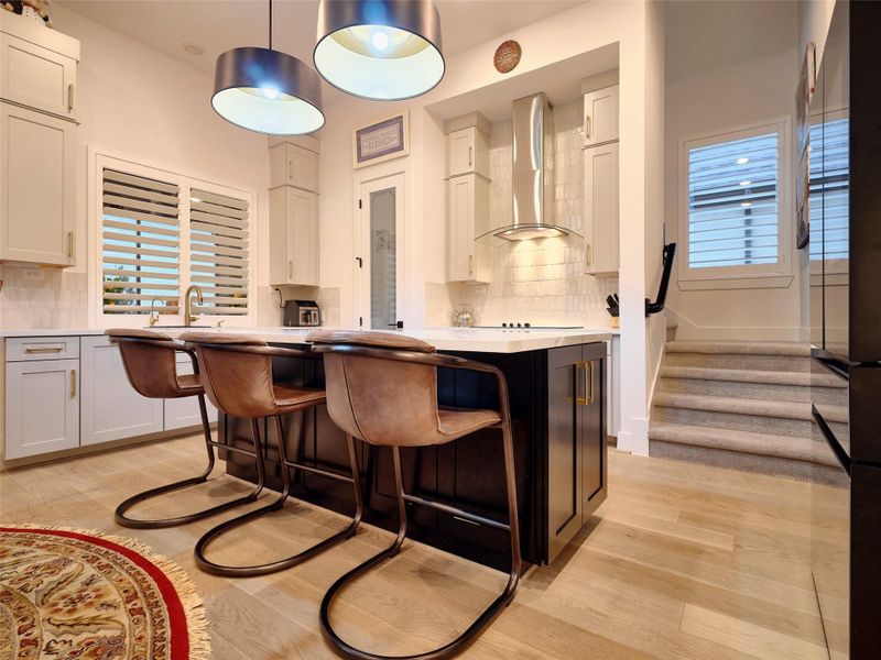 Custom cabinetry, porcelain countertops & Monogram appliances.